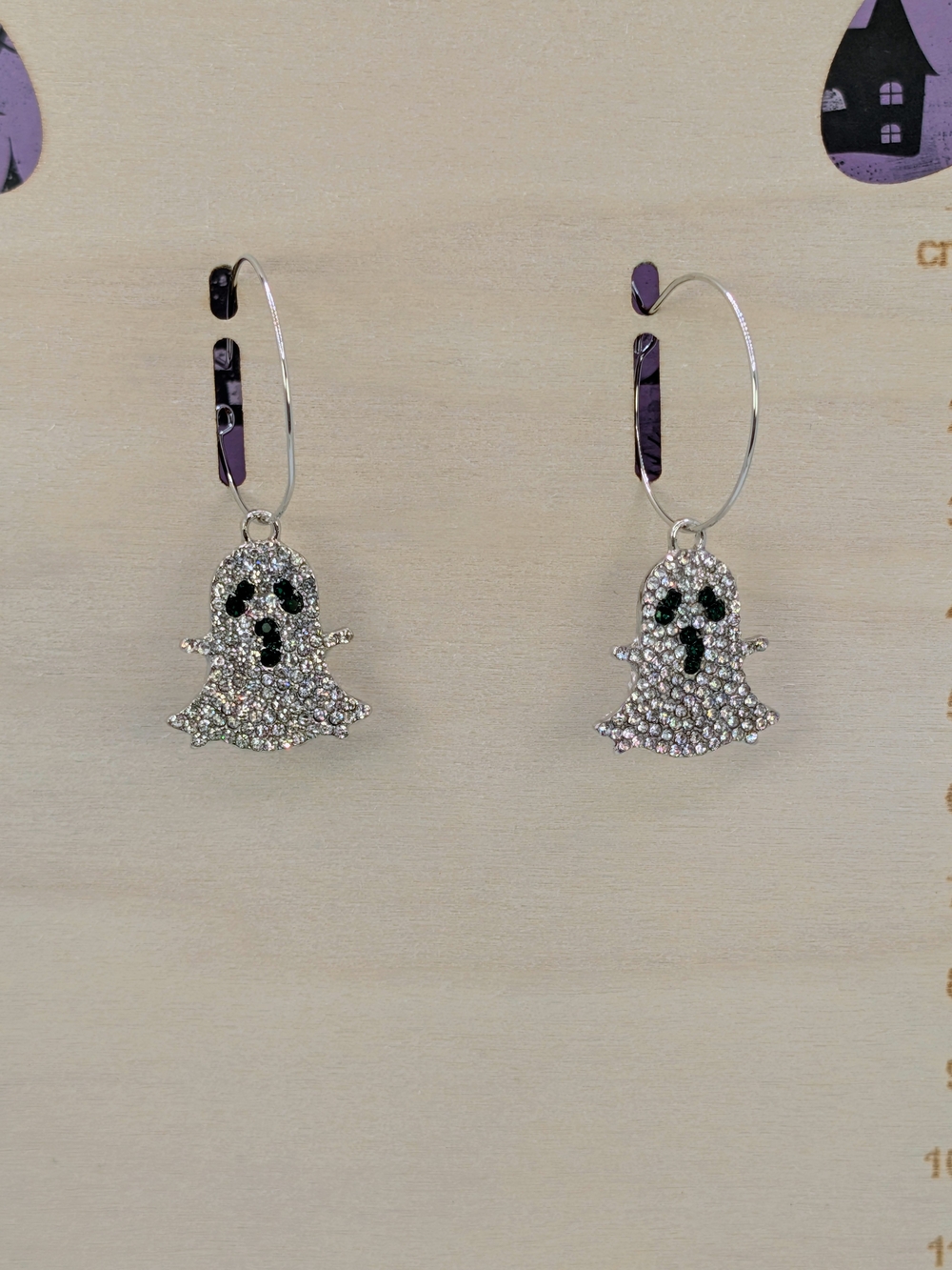 Silver Rhinestone Ghost Hoop Earrings with Dark Green Eye Accents